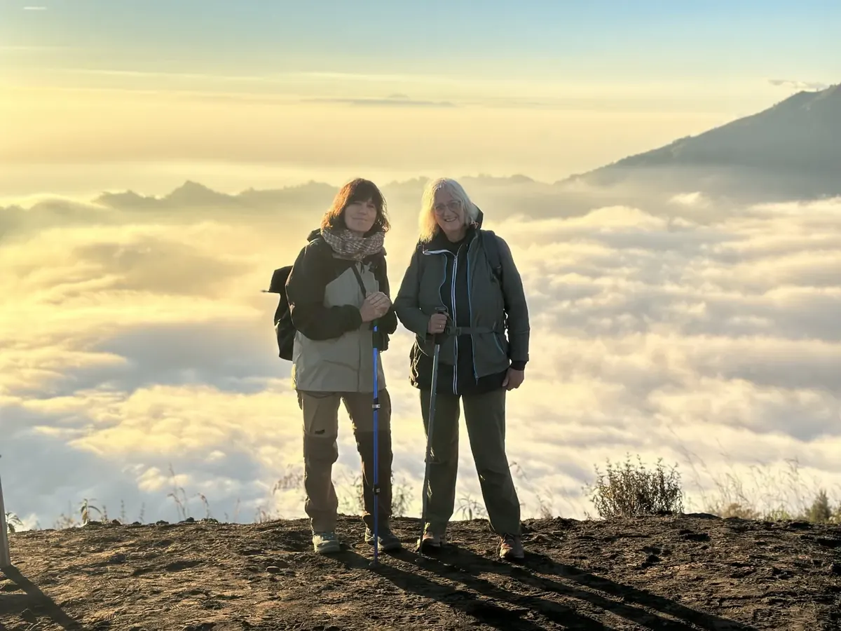 Two guests above the clouds at Mount Batur sunrise