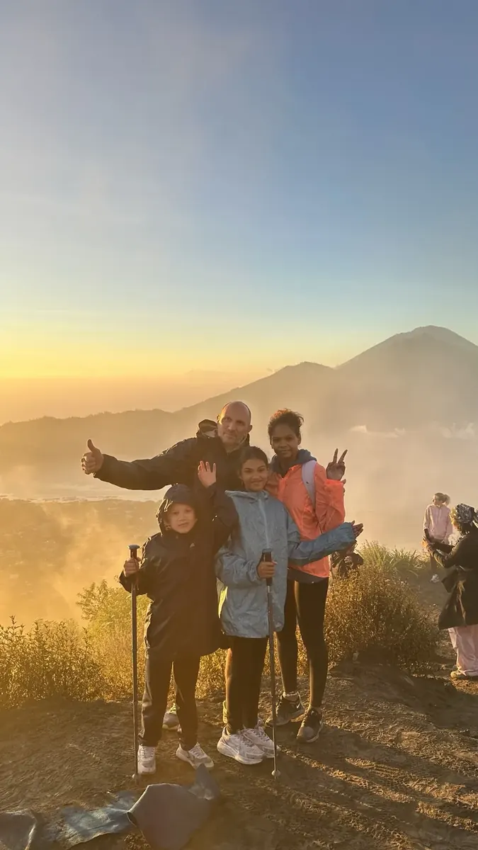 Family enjoying sunrise on Mount Batur